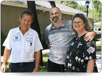 Three people smiling for photo